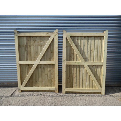 745 - A pair of wooden driveway gates each approx 125cm wide x 188cm high