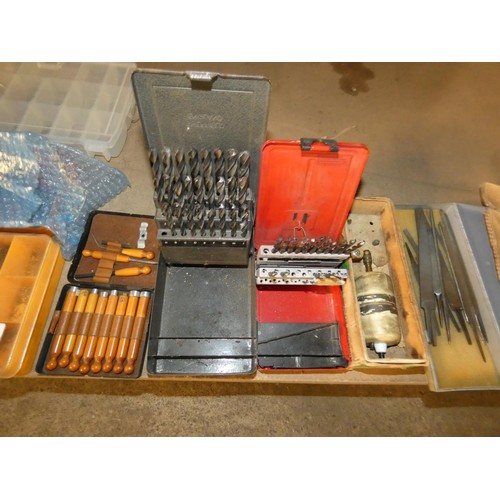 299 - A quantity of various model engineering items including small nuts / bolts, drill bits, files, a mod... 