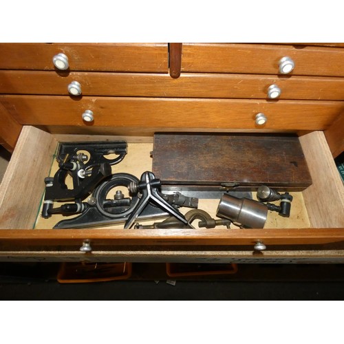 301 - An engineers wooden 7 drawer tool cabinet by Union containing various engineers tools