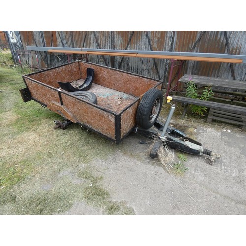 658 - A single axle un-braked braked tailer body size approx 201 x 123cm and side are 43cm high. A wheel b... 