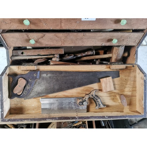 80 - A carpenters wooden chest containing a quantity of various vintage wood working tools