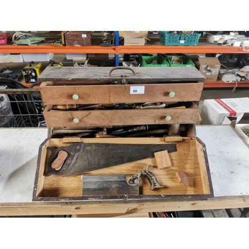 80 - A carpenters wooden chest containing a quantity of various vintage wood working tools