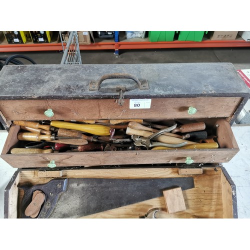 80 - A carpenters wooden chest containing a quantity of various vintage wood working tools