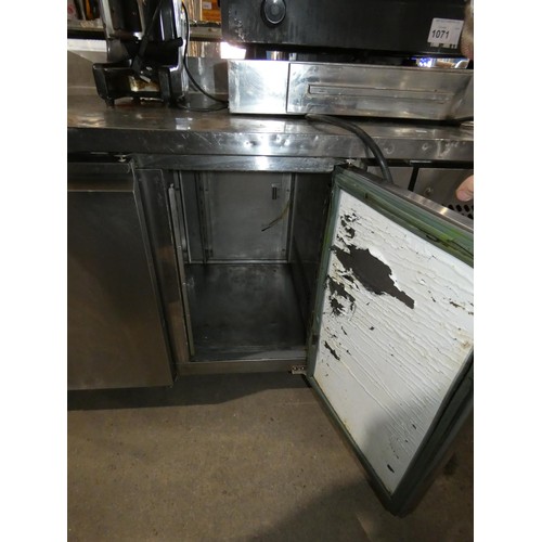 1074 - A commercial stainless steel 3 door bench fridge, no make or model visible