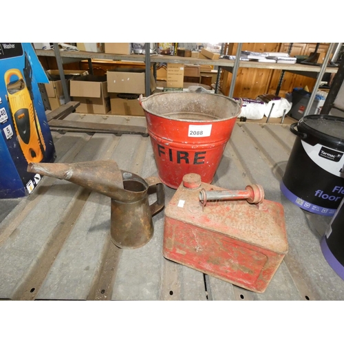 2088 - A vintage red metal Valor 10L fuel can, an oil can and a metal fire bucket