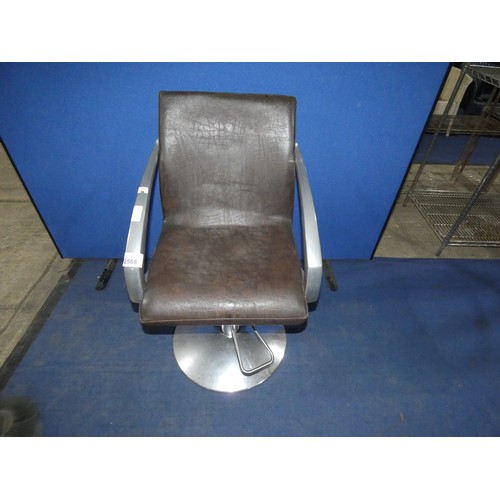 2571 - An aluminium framed brown upholstered swiveling rise and fall foot operated salon chair by the AGV g... 