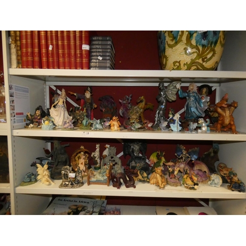 3014 - A collection of decorative resin fantasy figures (two shelves)