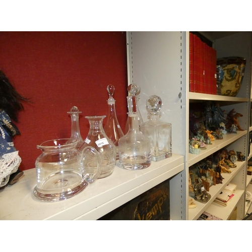 3019 - A collection of six miscellaneous glass decanters and a glass water jug