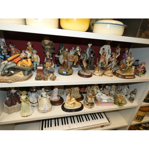 3022 - A collection of decorative resin and ceramic figures (2 shelves)