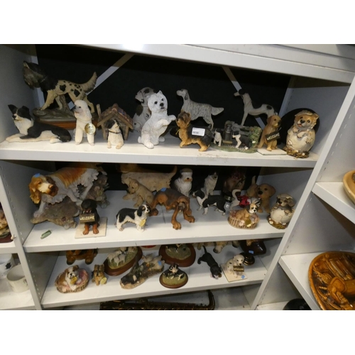 3030 - A collection of resin and ceramic dogs (three shelves)