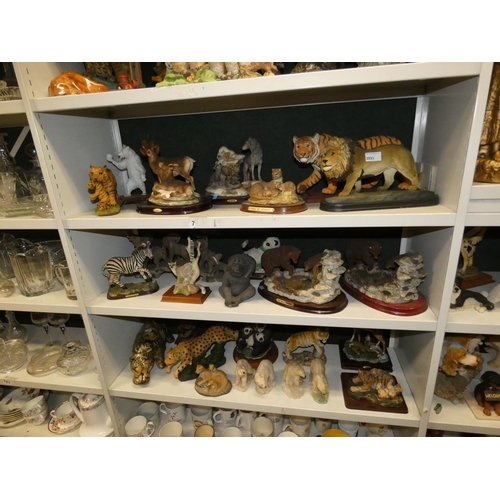 3033 - A collection of resin and ceramic wild animals (3 shelves)