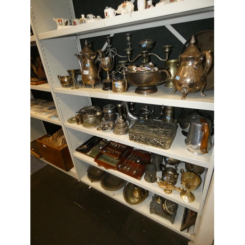 3055 - A large quantity of miscellaneous decorative silver-plated ware and cutlery (4 shelves)