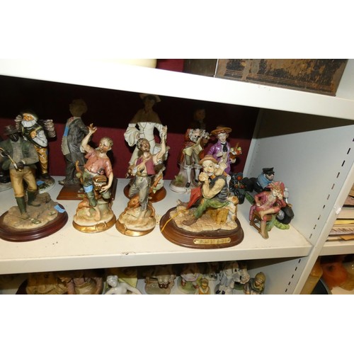 3022 - A collection of decorative resin and ceramic figures (2 shelves)