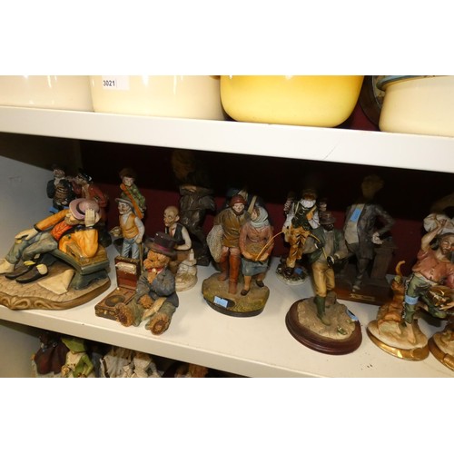 3022 - A collection of decorative resin and ceramic figures (2 shelves)