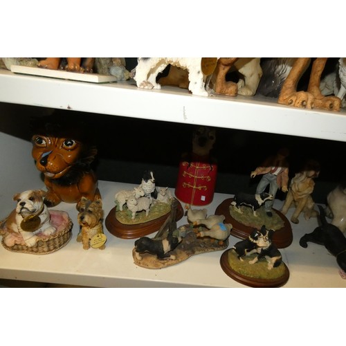 3030 - A collection of resin and ceramic dogs (three shelves)