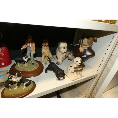 3030 - A collection of resin and ceramic dogs (three shelves)