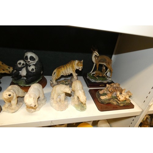 3033 - A collection of resin and ceramic wild animals (3 shelves)