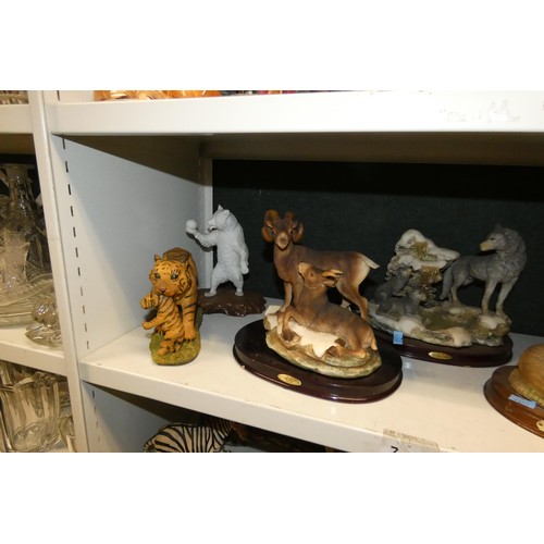 3033 - A collection of resin and ceramic wild animals (3 shelves)