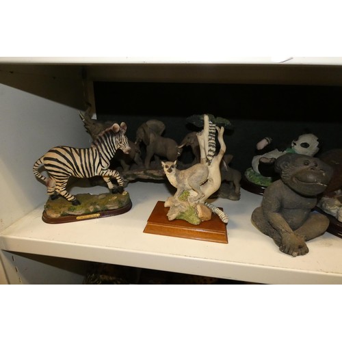 3033 - A collection of resin and ceramic wild animals (3 shelves)