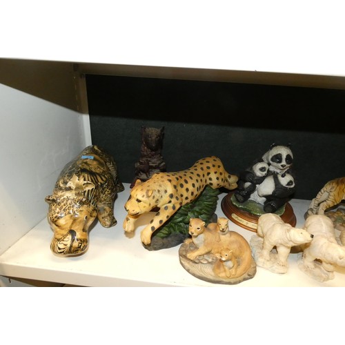 3033 - A collection of resin and ceramic wild animals (3 shelves)