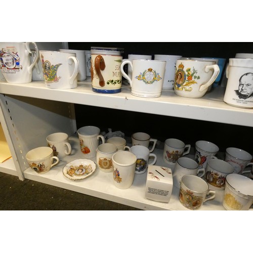 3034 - A collection of royal commemorative mugs and similar china (two shelves)