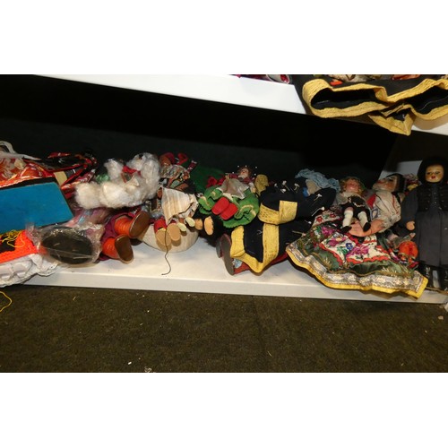 3045 - A collection of miscellaneous souvenir dolls (2 shelves)