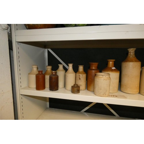 3048 - A quantity of decorative jardiniers and a quantity of vintage stoneware jars (two shelves)