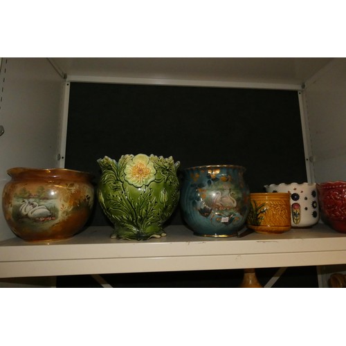 3048 - A quantity of decorative jardiniers and a quantity of vintage stoneware jars (two shelves)