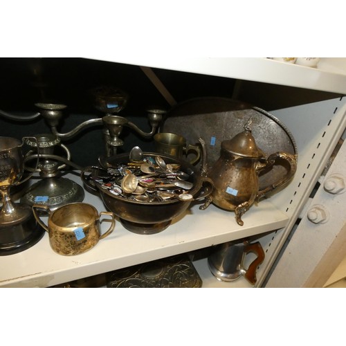 3055 - A large quantity of miscellaneous decorative silver-plated ware and cutlery (4 shelves)