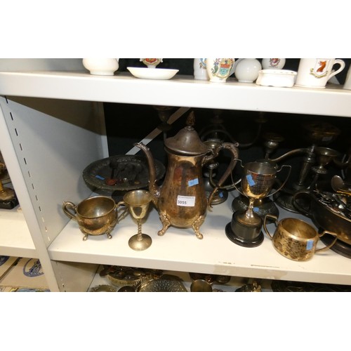 3055 - A large quantity of miscellaneous decorative silver-plated ware and cutlery (4 shelves)