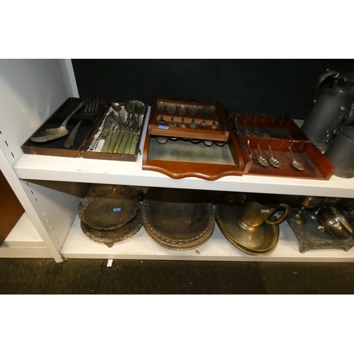 3055 - A large quantity of miscellaneous decorative silver-plated ware and cutlery (4 shelves)