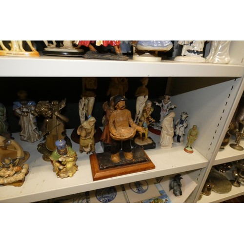 3057 - A large quantity of miscellaneous decorative resin and ceramic figures (three shelves)