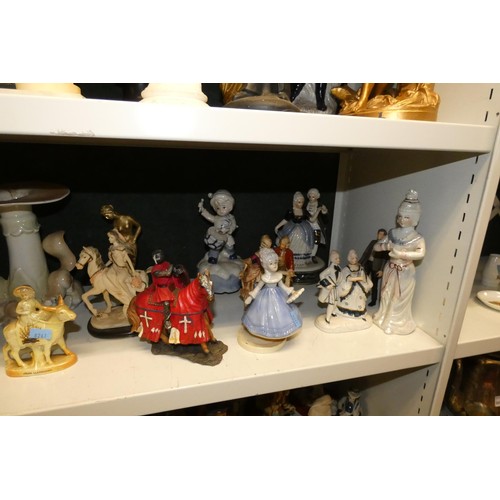 3057 - A large quantity of miscellaneous decorative resin and ceramic figures (three shelves)