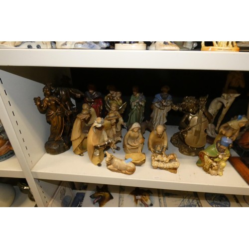 3057 - A large quantity of miscellaneous decorative resin and ceramic figures (three shelves)