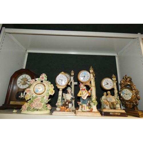 3060 - A quantity of miscellaneous decorative resin, ceramic, wooden cased and other clocks (2 shelves)