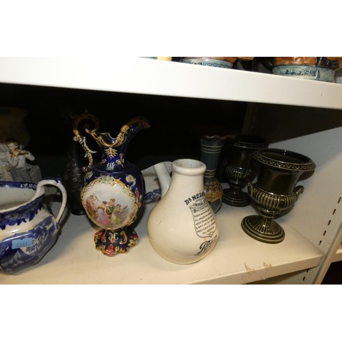 3061 - A quantity of miscellaneous decorative beer steins, Toby & character jugs and vases etc (three shelv... 