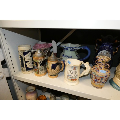 3061 - A quantity of miscellaneous decorative beer steins, Toby & character jugs and vases etc (three shelv... 