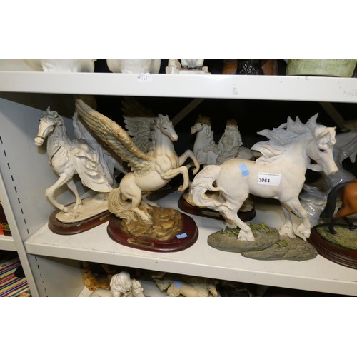 3064 - A quantity of miscellaneous decorative resin, ceramic and other horse ornaments (two shelves)