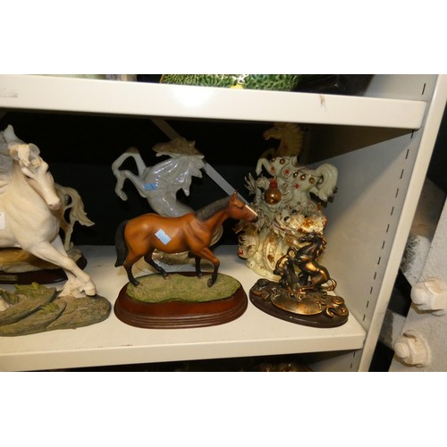 3064 - A quantity of miscellaneous decorative resin, ceramic and other horse ornaments (two shelves)