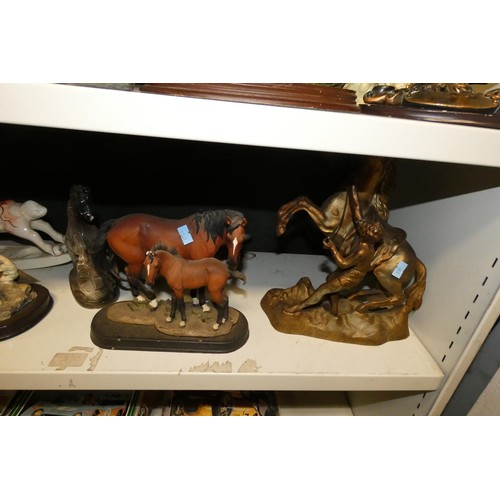 3064 - A quantity of miscellaneous decorative resin, ceramic and other horse ornaments (two shelves)