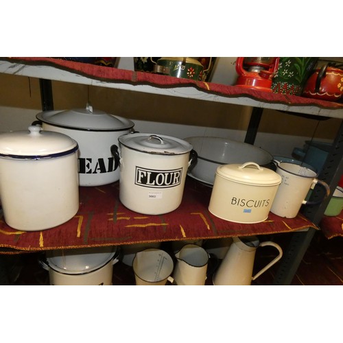 3083 - A quantity of vintage white and cream enamelled kitchen ware including; bread bins, flour bins, jugs... 