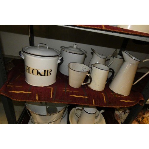 3083 - A quantity of vintage white and cream enamelled kitchen ware including; bread bins, flour bins, jugs... 