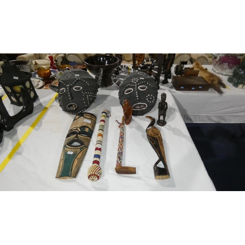 Two decorative hessian tribal masks and various tribal decorated ...