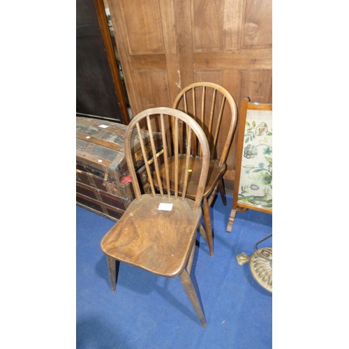 3518 - A pair of dark wood Windsor style rail back kitchen chairs