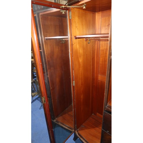 3491 - Mahogany bow front wardrobe with three panel doors & three drawers, approximately 156cm wide.  The t... 