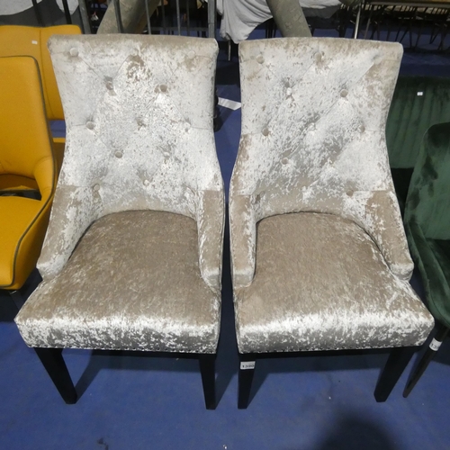 1390 - 2 silver upholstered button back dining chairs each with metal stud decoration and a rear ring handl... 