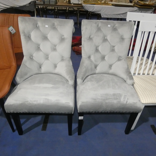 1395 - 2 light grey upholstered button back dining chairs each with metal stud decoration and a rear ring h... 