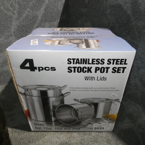 2033 - A unused 4 piece stainless steel pot set with lids, boxed