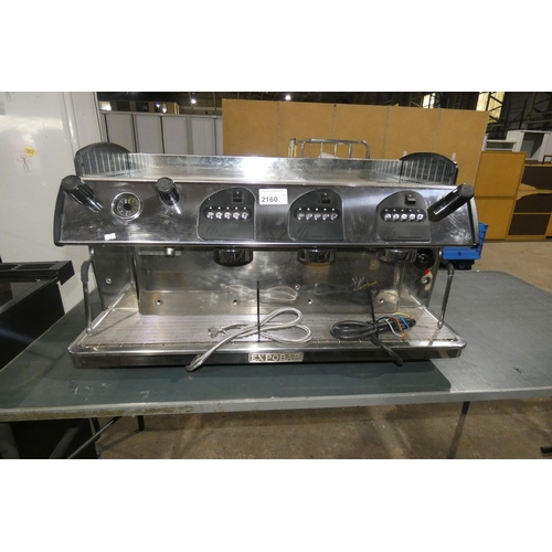 A commercial stainless steel 3 group coffee machine with 2 x steam