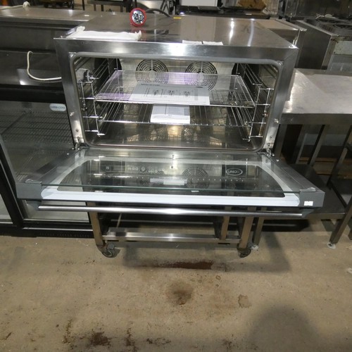 2112 - A commercial stainless steel 4 grid fan oven by Unox type Rossela xft190 dual voltage - 3phase - tra... 